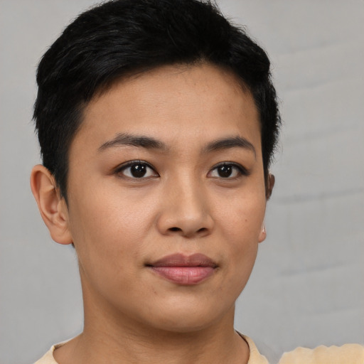 Joyful asian young-adult female with short  brown hair and brown eyes