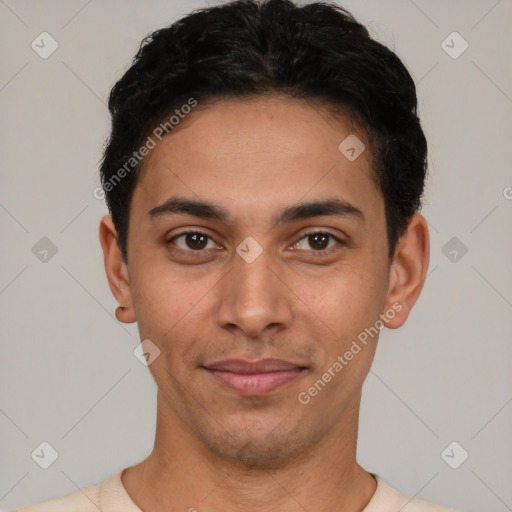 Joyful latino young-adult male with short  black hair and brown eyes