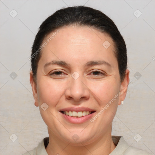 Joyful white adult female with short  brown hair and brown eyes