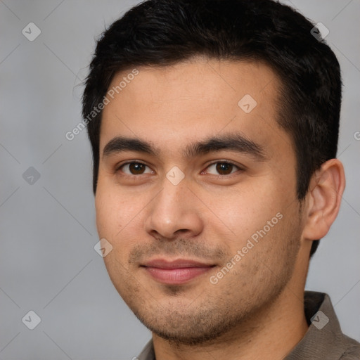 Joyful white young-adult male with short  black hair and brown eyes