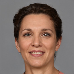 Joyful white adult female with short  brown hair and brown eyes