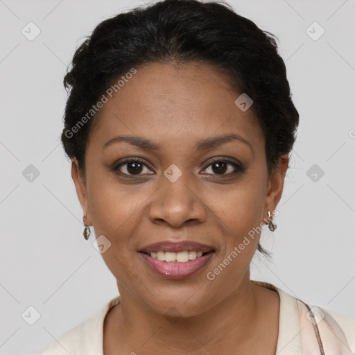 Joyful black adult female with short  brown hair and brown eyes