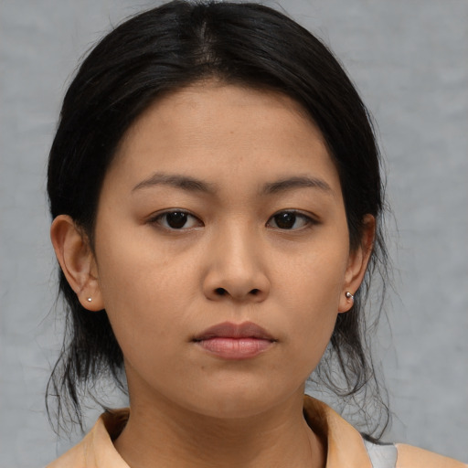 Neutral asian young-adult female with medium  black hair and brown eyes