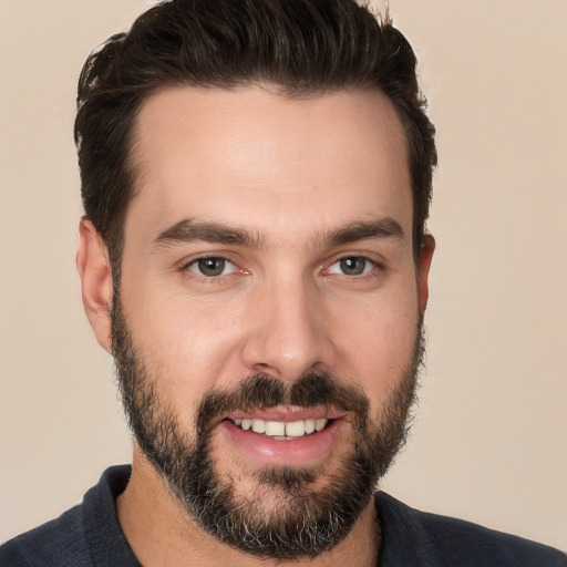 Joyful white young-adult male with short  brown hair and brown eyes