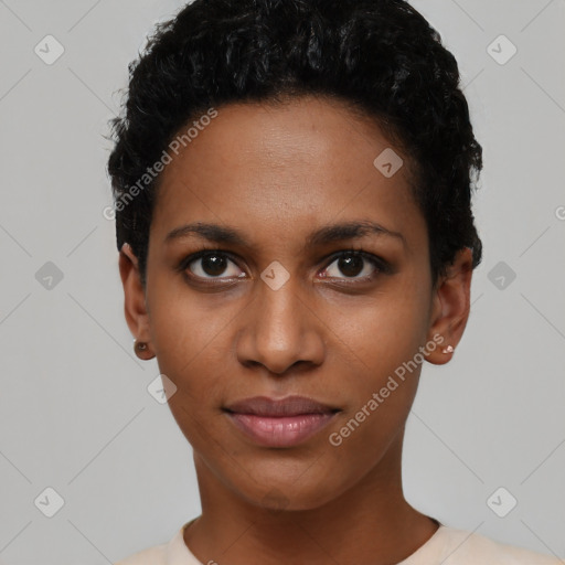 Joyful black young-adult female with short  black hair and brown eyes