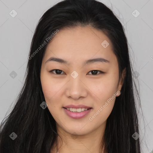 Joyful asian young-adult female with long  brown hair and brown eyes