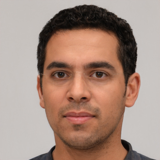 Neutral white young-adult male with short  black hair and brown eyes