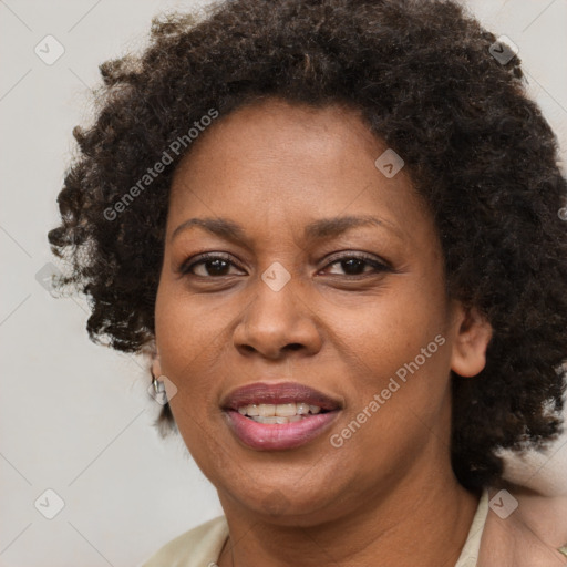 Joyful black adult female with short  brown hair and brown eyes