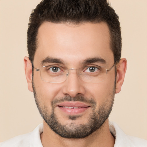 Joyful white young-adult male with short  brown hair and brown eyes