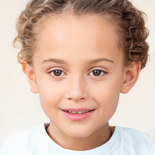 Joyful white child female with short  brown hair and brown eyes