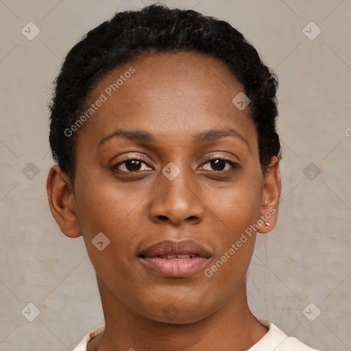 Joyful black young-adult female with short  brown hair and brown eyes