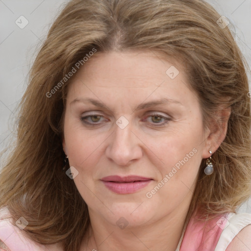 Joyful white adult female with medium  brown hair and blue eyes