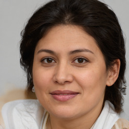 Joyful white adult female with medium  brown hair and brown eyes