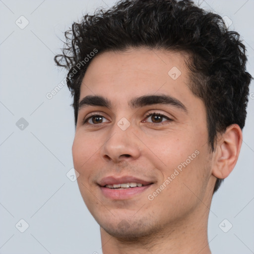 Joyful white young-adult male with short  black hair and brown eyes