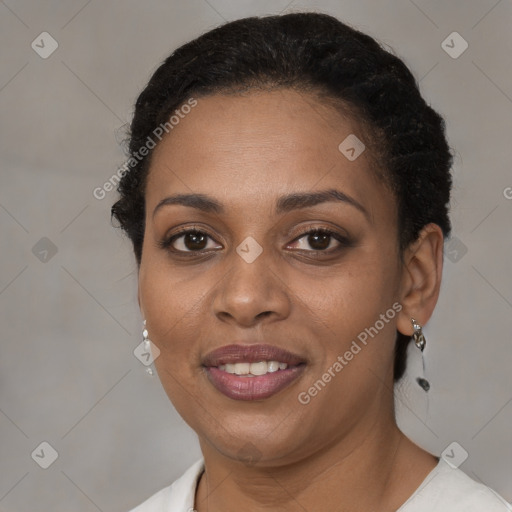 Joyful black young-adult female with short  brown hair and brown eyes