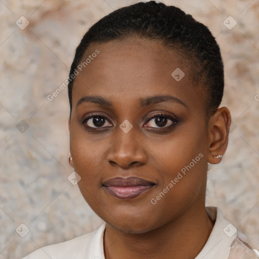 Joyful black young-adult female with short  brown hair and brown eyes