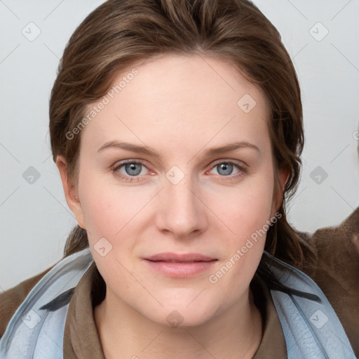 Joyful white young-adult female with medium  brown hair and blue eyes