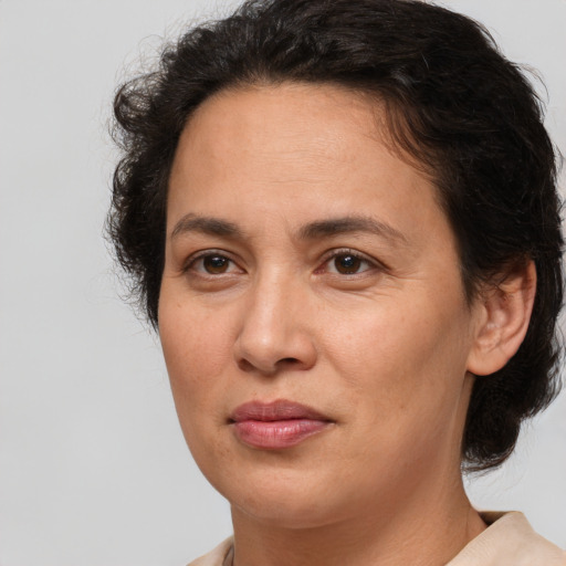 Joyful white adult female with medium  brown hair and brown eyes