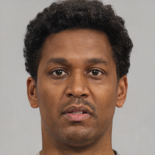 Neutral black young-adult male with short  brown hair and brown eyes