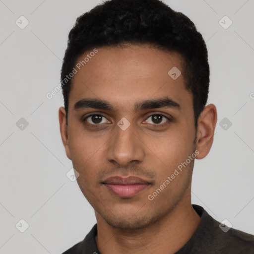 Neutral latino young-adult male with short  black hair and brown eyes