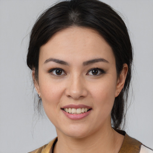 Joyful white young-adult female with medium  brown hair and brown eyes