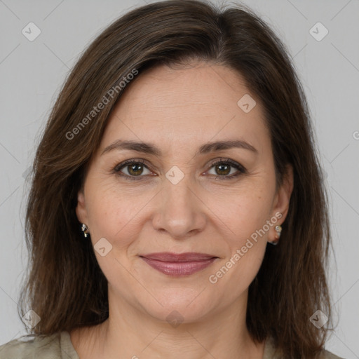 Joyful white adult female with medium  brown hair and brown eyes