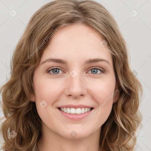 Joyful white young-adult female with long  brown hair and green eyes