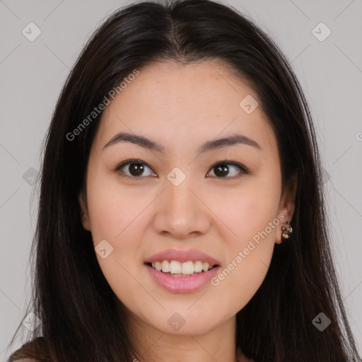 Joyful asian young-adult female with long  brown hair and brown eyes