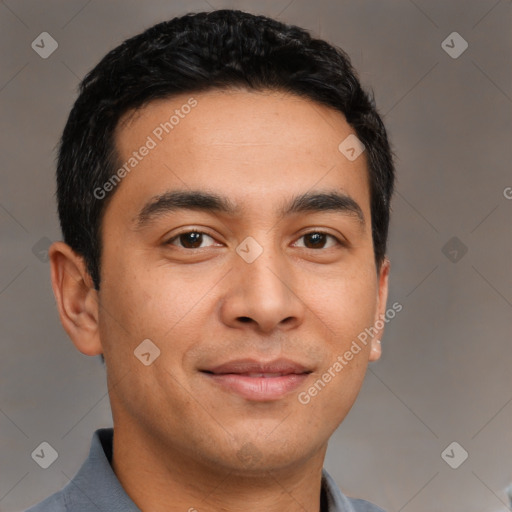 Joyful latino young-adult male with short  brown hair and brown eyes