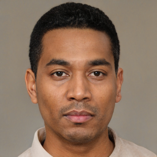 Neutral latino young-adult male with short  black hair and brown eyes