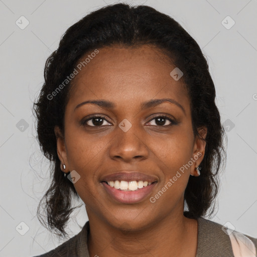 Joyful black young-adult female with long  brown hair and brown eyes