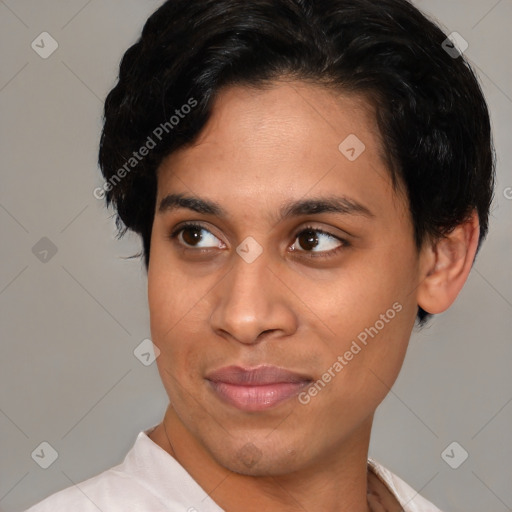 Joyful latino young-adult female with short  brown hair and brown eyes