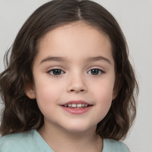 Joyful white child female with medium  brown hair and brown eyes