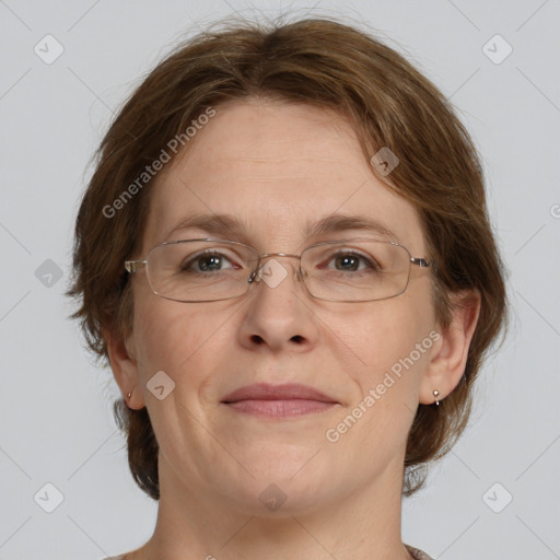 Joyful white adult female with medium  brown hair and grey eyes