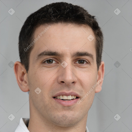 Joyful white young-adult male with short  brown hair and brown eyes