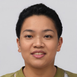 Joyful asian young-adult female with short  black hair and brown eyes