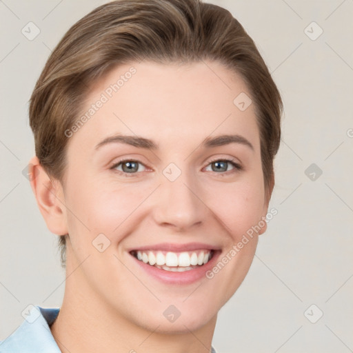 Joyful white young-adult female with short  brown hair and grey eyes