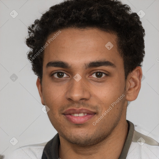 Joyful latino young-adult male with short  brown hair and brown eyes