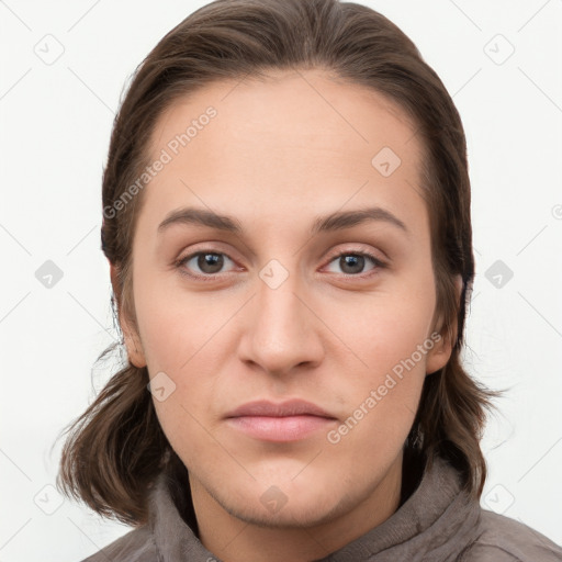 Neutral white young-adult female with long  brown hair and brown eyes