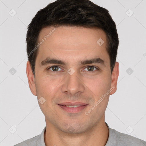 Joyful white young-adult male with short  brown hair and brown eyes