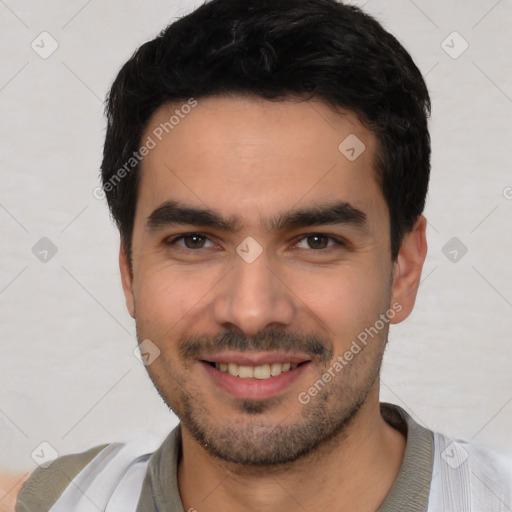 Joyful white young-adult male with short  black hair and brown eyes