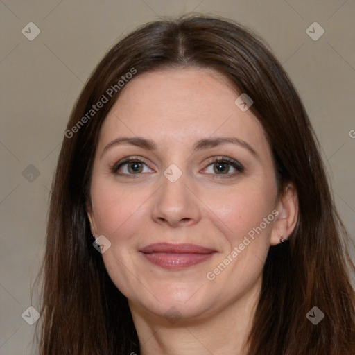 Joyful white adult female with long  brown hair and brown eyes