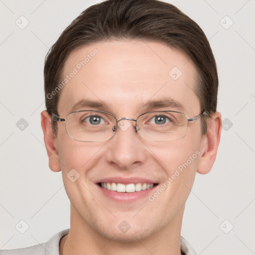 Joyful white adult male with short  brown hair and grey eyes