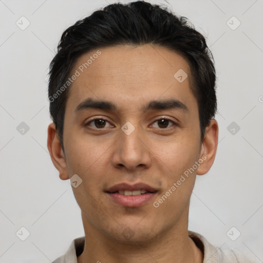 Joyful white young-adult male with short  black hair and brown eyes