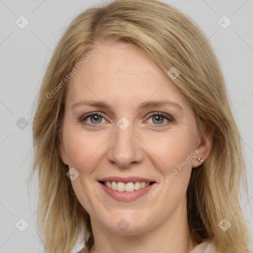 Joyful white adult female with medium  brown hair and blue eyes