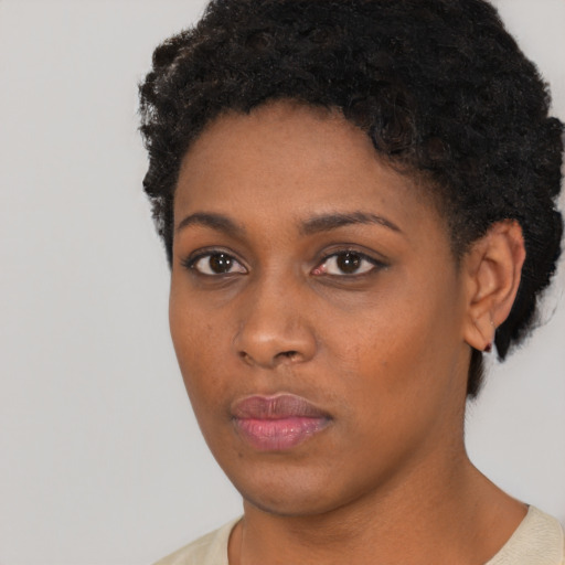 Neutral black young-adult female with short  black hair and brown eyes