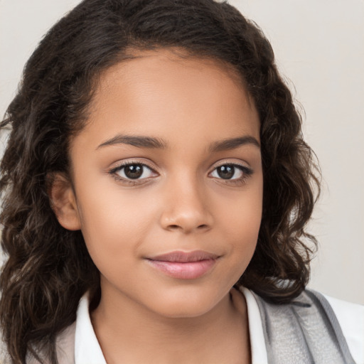 Joyful white child female with long  brown hair and brown eyes