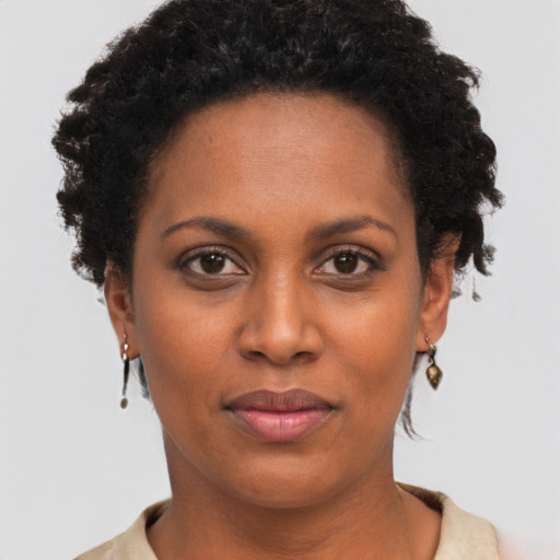 Neutral black young-adult female with short  brown hair and brown eyes