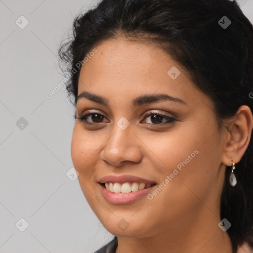 Joyful latino young-adult female with long  brown hair and brown eyes