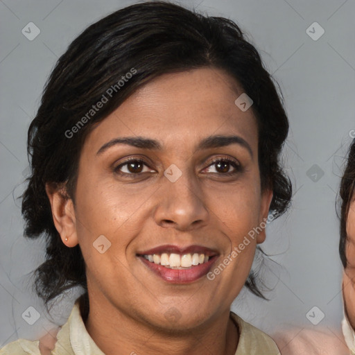 Joyful black adult female with medium  brown hair and brown eyes